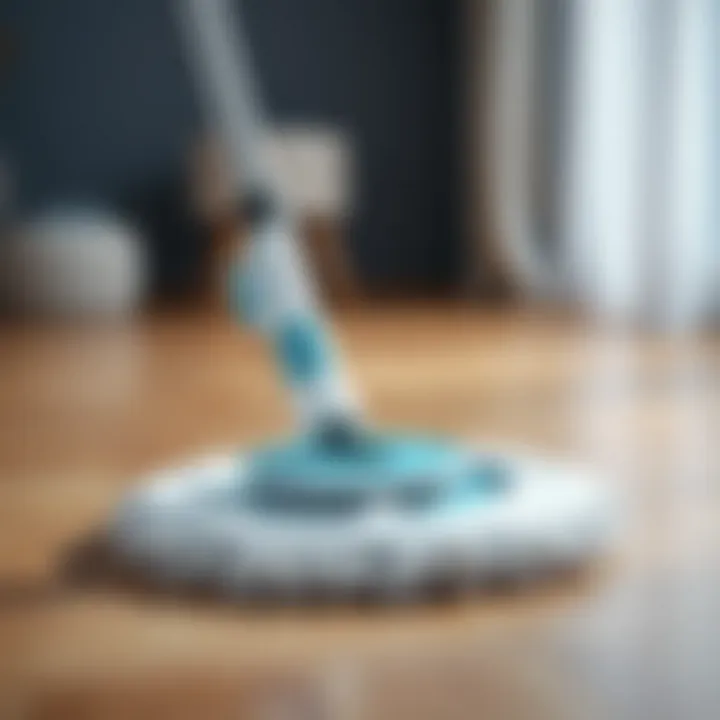 Compact Neo Spin Go mop with rotating mechanism and mop head on a wooden floor